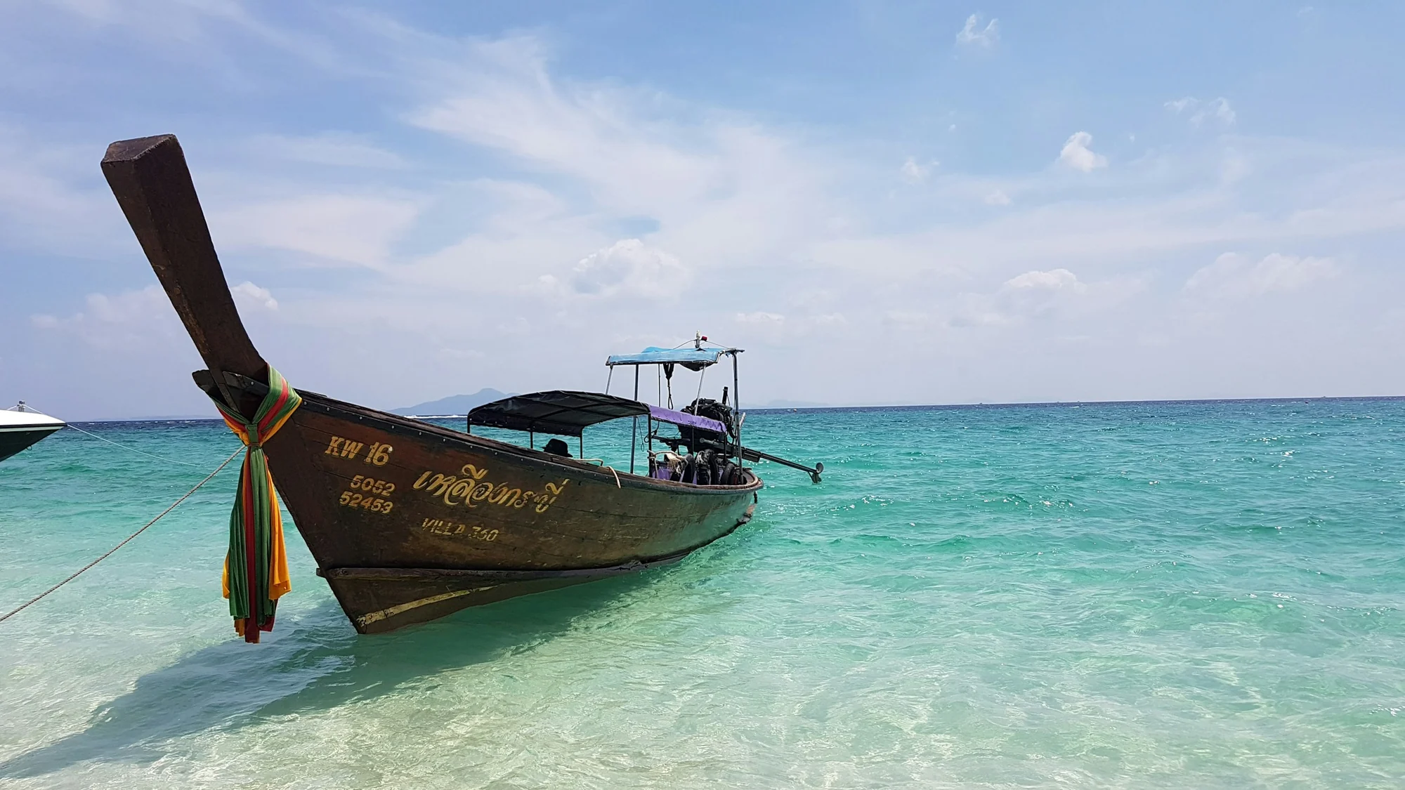 Clear turquoise sea under a pale blue sky